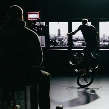 Matt Wilhelm, professional BMX rider, doing stunts in front of an LED wall while a Cinematographer films it
