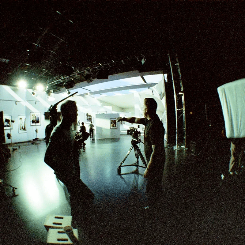 A film crew using virtual production and Unreal engine to set up a shot in a virtual production studio