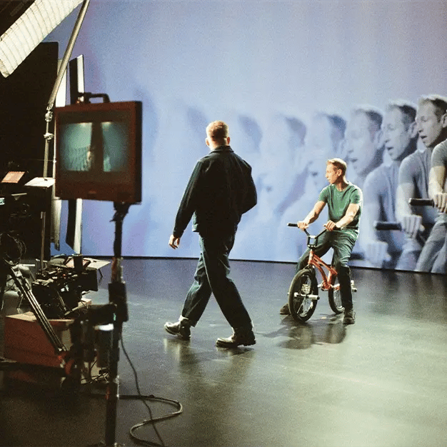 A director walks across set in a virtual production stage