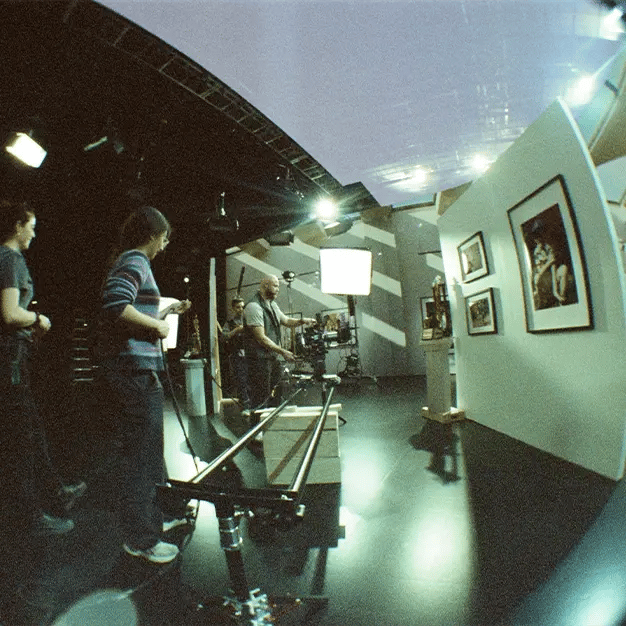 A film crew operates a Dana Dolly on a virtual production LED stage