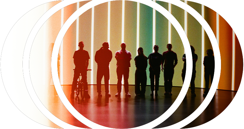 Cast and crew stand in front of an LED wall on a film set