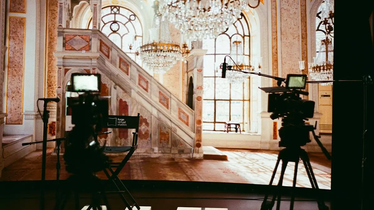 Two RED Cinema cameras in front of an LED wall on a film set