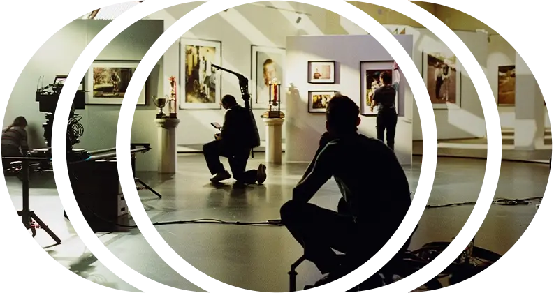 A camera crew filming in a virtual production studio on an LED wall